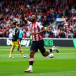 "Brentford vs Manchester United fans celebrating at stadium"