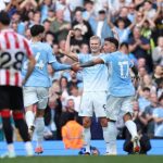 Erling Haaland celebrating a goal with team mate